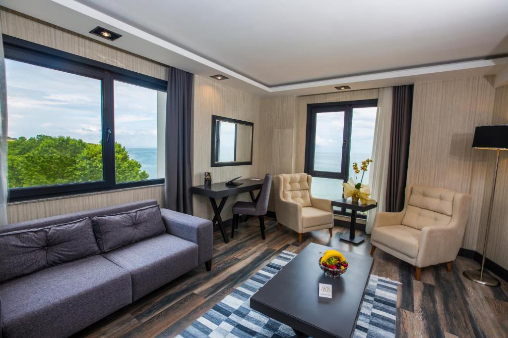 deluxe king room with sofa bed and sea view
